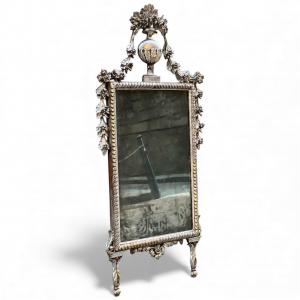 Carved and silver-gilt wood mirror